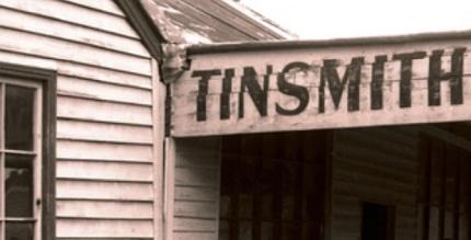 Tinsmith sign on old weatherboard building