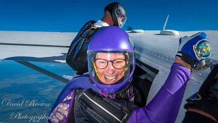 JH on side of plane (at altitude) before jump