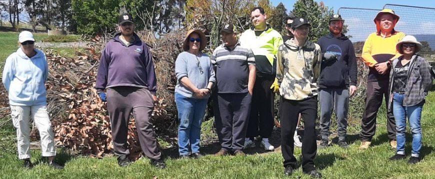 Gippsland Interchange folks in front of the burnoff pile