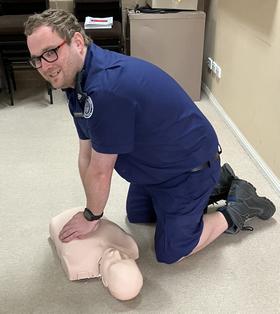 CFA member practicing CPR on manequin