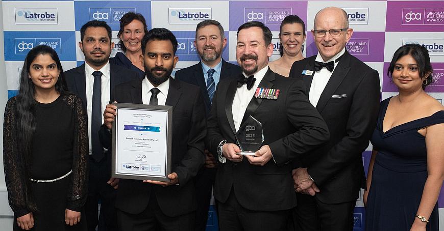 The whole team showing the award