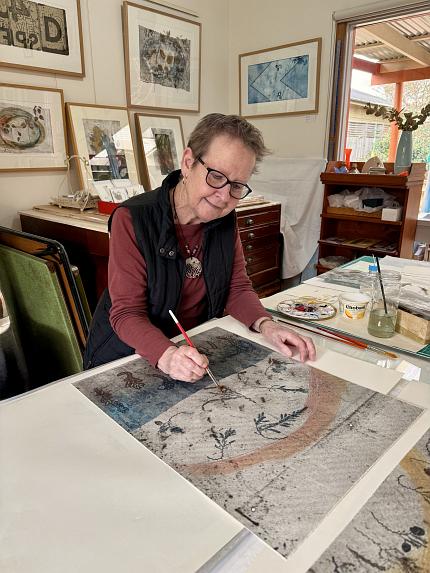 Jenny Peterson working on a painting in her studio