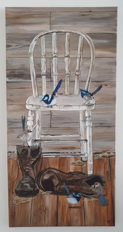 Antique chair on a verandah, with blue wrens